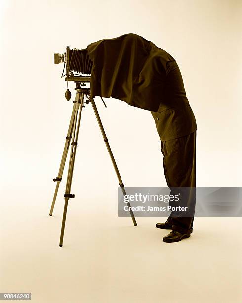 photographer with camera - old photographer stock pictures, royalty-free photos & images