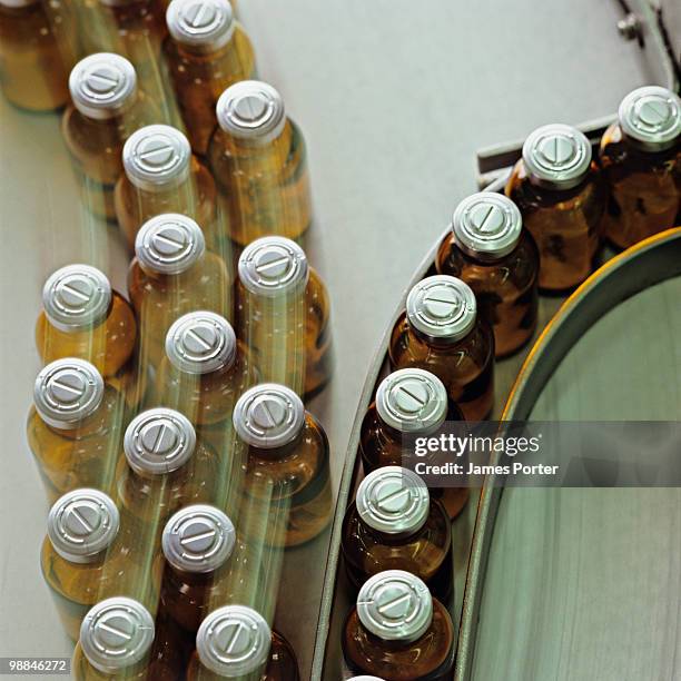 medicine bottles - pharma manufacturing stock pictures, royalty-free photos & images