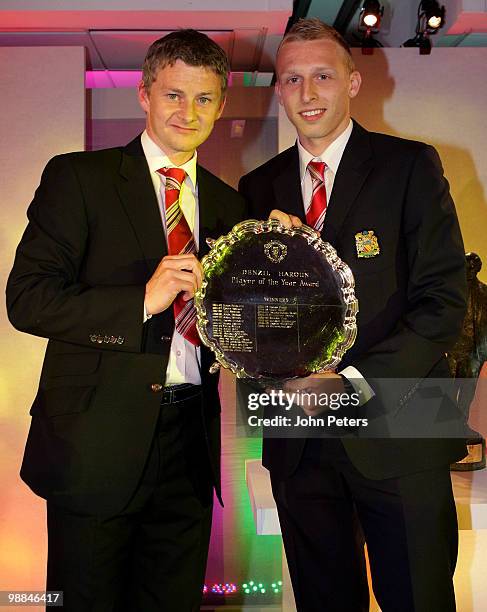 Ritchie De Laet of Manchester United is presented with the Denzil Haroun Reserve Team Player of the Year award by Reserve Team Manager Ole Gunnar...