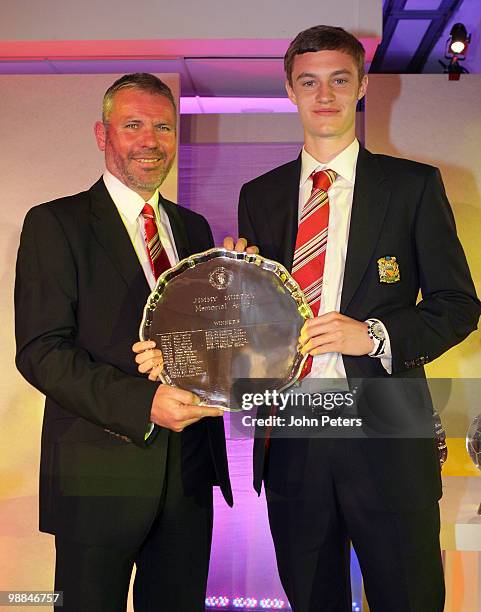 William Keane of Manchester United is presented with the Jimmy Murphy Academy Youth Player of the Year award by Academy Director Brian McClair during...