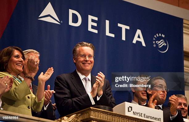 Ed Bastian, president of Delta Air Lines Inc., center, participates in the closing bell ceremony on the floor of the New York Stock Exchange in New...