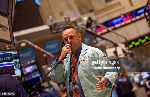 Joseph Bolognesi works on the floor of the New York Stock Exchange in New York, U.S., on Tuesday, May 4, 2010. U.S. Equities tumbled the most since...