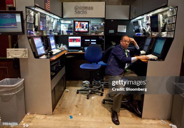 Trader works in the Goldman Sachs Group Inc. Booth of the New York Stock Exchange in New York, U.S., on Tuesday, May 4, 2010. U.S. Equities tumbled...