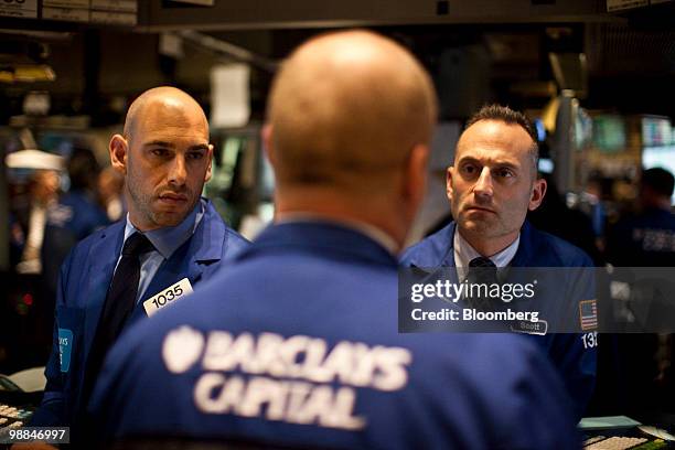 Traders work on the floor of the New York Stock Exchange in New York, U.S., on Tuesday, May 4, 2010. U.S. Equities tumbled the most since February...