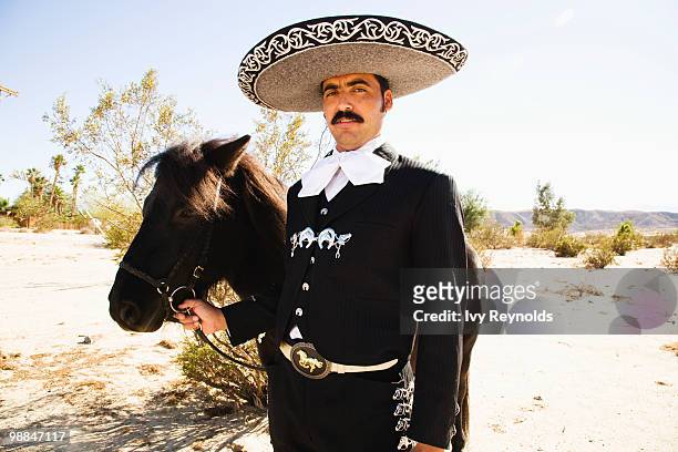 man in sombrero with horse - moustaches animales fotografías e imágenes de stock