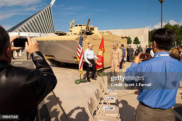 May 4: Onlookers take pictures of the U.S. Marines' newest Expeditionary Fighting Vehicle prototype as it sits in front of the National Museum of the...