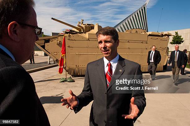May 4: Mark C. Roualet, president of General Dynamics Land Systems, and U.S. Rep. Rob Wittman, R-Va., talk before the ceremony unveiling of the...