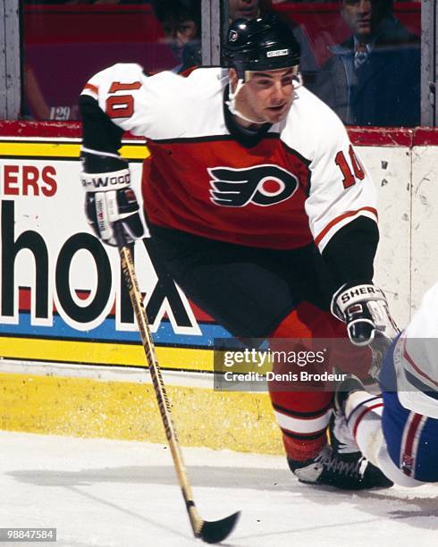 John LeClair of the Philadelphia Flyers skates against the Montreal Canadiens in the late 1990's at the Montreal Forum in Montreal, Quebec, Canada.