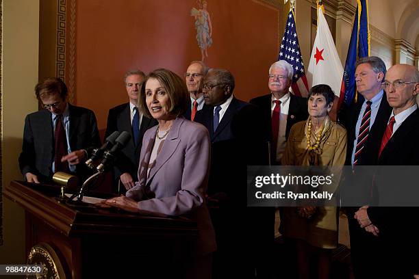 May 4: Speaker of the House Nancy Pelosi addresses reporters after a three hour meeting with prominent economists Tuesday. In the background, from...