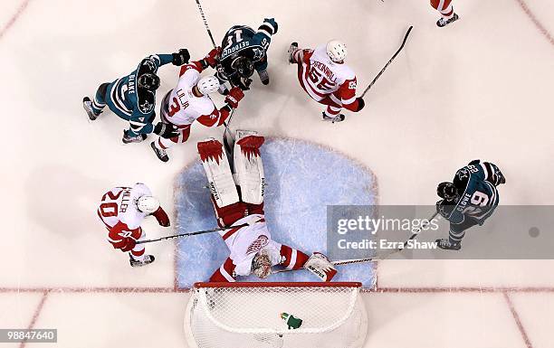 Jimmy Howard of the Detroit Red Wings lies down on the ice to make a save during their game against the San Jose Sharks in Game Two of the Western...