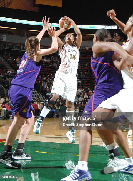 Devanei Hampton of the Seattle Storm shoots against DeWanna Bonner of the Phoenix Mercury during the game on May 2, 2010 at Key Arena in Seattle,...