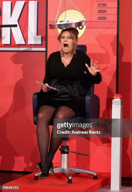 Pregnant TV host Barbara Schoeneberger reacts during the SKL show 'Tag des Gluecks' at Tempodrom on May 4, 2010 in Berlin, Germany.