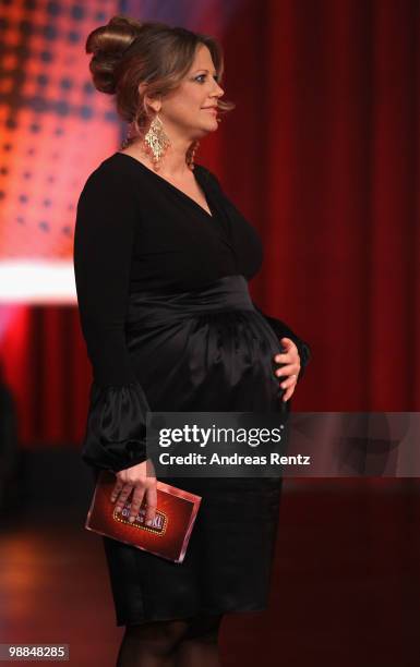 Pregnant TV host Barbara Schoeneberger reacts during the SKL show 'Tag des Gluecks' at Tempodrom on May 4, 2010 in Berlin, Germany.