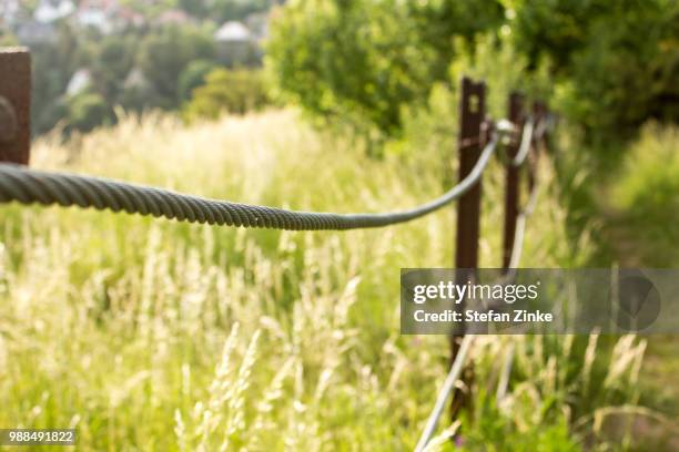 a fence on a hill - zinke stock pictures, royalty-free photos & images