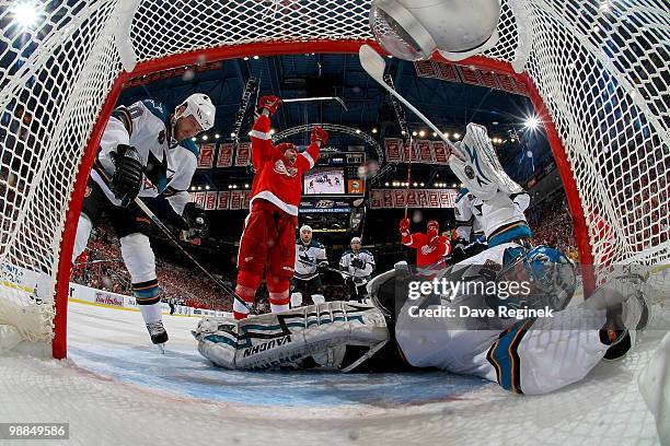 Tomas Holmstrom of the Detroit Red Wings celebrates after scoring on Evgeni Nabokov of the San Jose Sharks during Game Three of the Western...