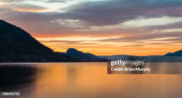 okanagan sunset - brian murphy stock pictures, royalty-free photos & images