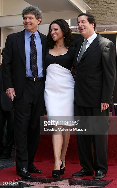 Warner Bros. Entertainment COO Alan Horn, actress Julia Louis Dreyfus and Warner Bros. Entertainment CEO Peter Roth attend the Hollywood Walk of Fame...