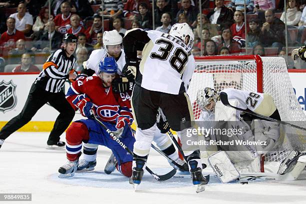 Marc-Andre Fleury of the Pittsburgh Penguins stops the puck on an attempt by Tom Pyatt of the Montreal Canadiens in Game Three of the Eastern...