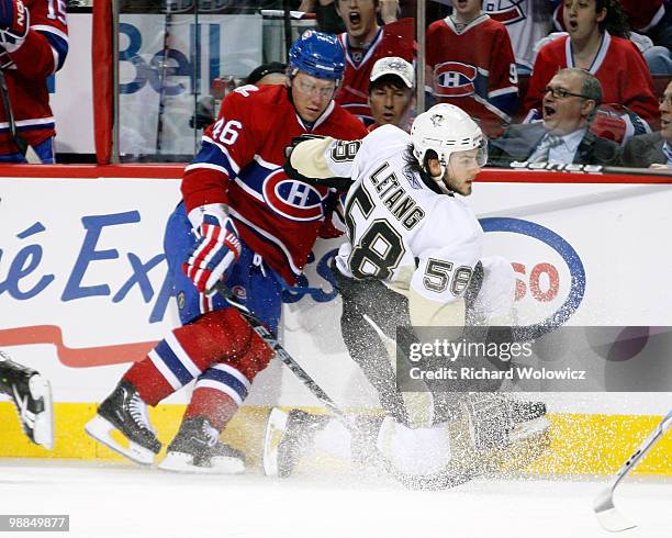 Andrei Kostitsyn of the Montreal Canadiens body checks Kris Letang of the Pittsburgh Penguins in Game Three of the Eastern Conference Semifinals...