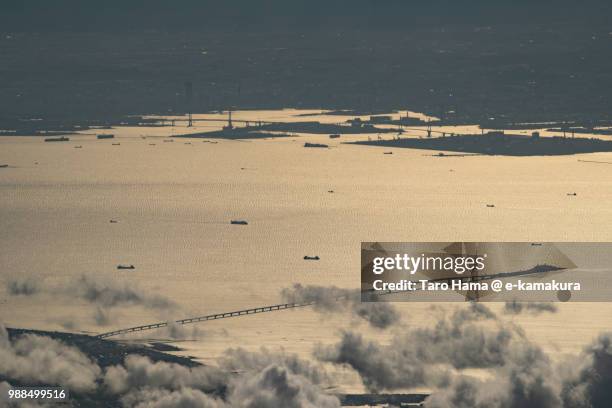 many ships sailing on tokyo bay, yokohama city in kanagawa prefecture and kisarazu city in chiba prefecture in japan sunset time aerial view from airplane - yokohama bay bridge stock pictures, royalty-free photos & images