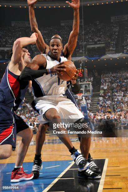 Dwight Howard of the Orlando Magic drives against Zaza Pachulia of the Atlanta Hawks in Game One of the Eastern Conference Semifinals during the 2010...