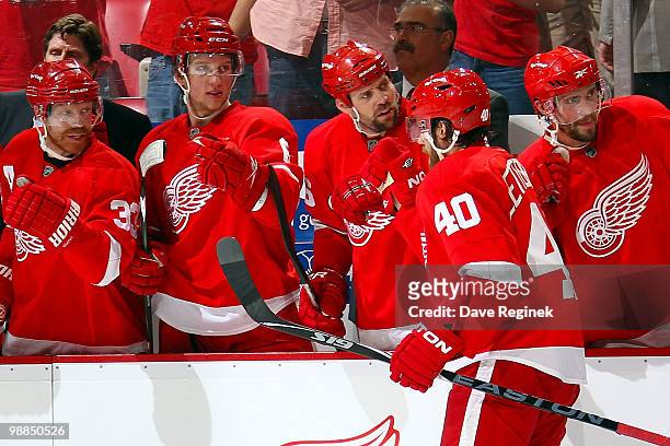Henrik Zetterberg of the Detroit Red Wings gets congratulated by teammates Pavel Datsyuk, Tomas Holmstrom, Justin Abdelkader and Kris Draper for his...