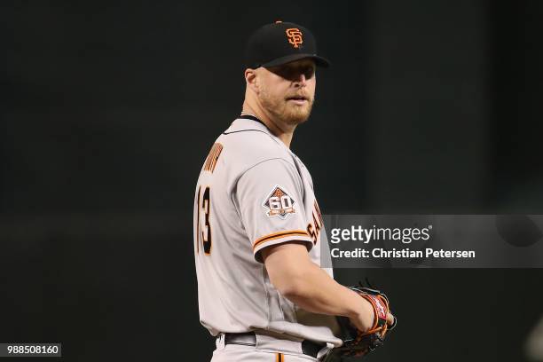 Relief pitcher Will Smith of the San Francisco Giants throws a warm up pitch during the ninth inning of the MLB game against the Arizona Diamondbacks...