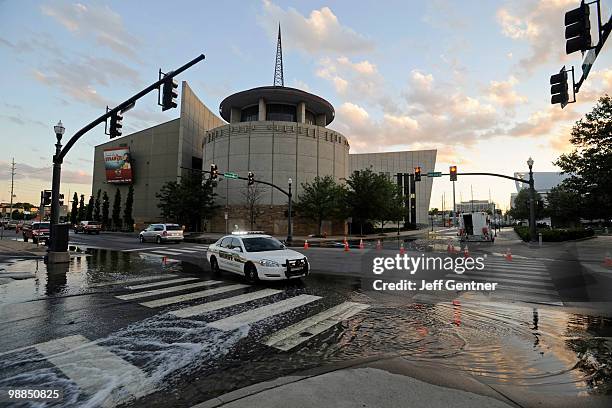 Water is pumped into street drains outside of The Country Music Hall of Fame on May 4, 2010 in Nashville, Tennessee. Massive rainstorms caused 10...