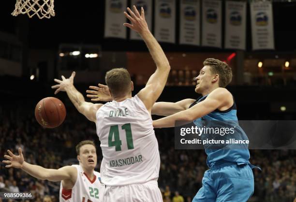 Alba's Marius Grigonis plays against Krasnodar's Brian Qvale during the Eurocup basketball match between ALBA Berlin and Lok. Kuban Krasnodar at the...