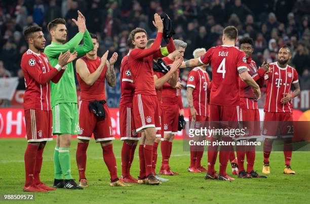 Munich's players celebrate after the Champions League soccer match between Bayern Munich and Paris St. Germain in the Allianz Arena in Munich,...