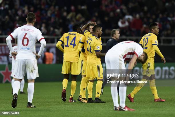 Juventus' Federico Bernardeschi cheers with his teammates after his score during the Champions League group match between Olympiacos Piraeus and...