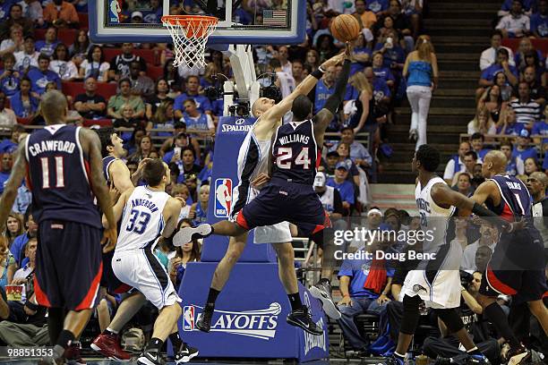 Marvin Williams of the Atlanta Hawks is stopped by Marcin Gortat of the Orlando Magic in Game One of the Eastern Conference Semifinals during the...