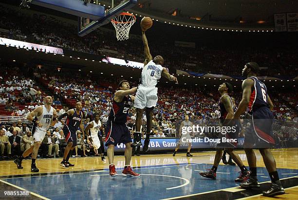 Anthony Johnson of the Orlando Magic gets a layup over Zaza Pachulia of the Atlanta Hawks in Game One of the Eastern Conference Semifinals during the...