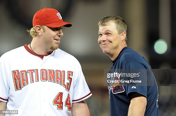 Adam Dunn of the Washington Nationals talks with Chipper Jones of the Atlanta Braves during the game at Nationals Park on May 4, 2010 in Washington,...