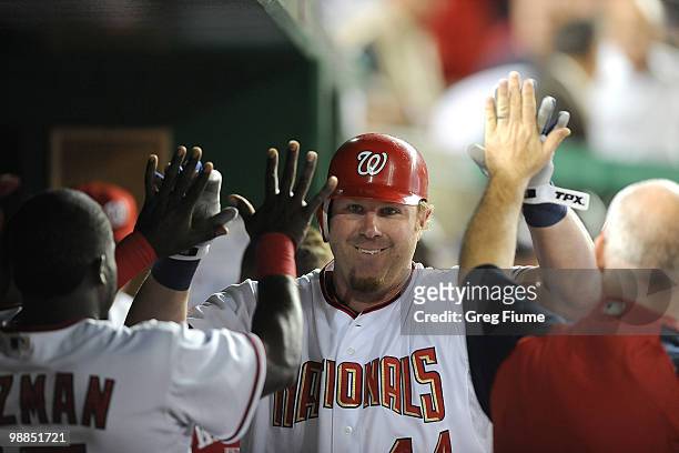 Adam Dunn of the Washington Nationals celebrates with teammates after hitting a home run in the sixth inning against the Atlanta Braves at Nationals...