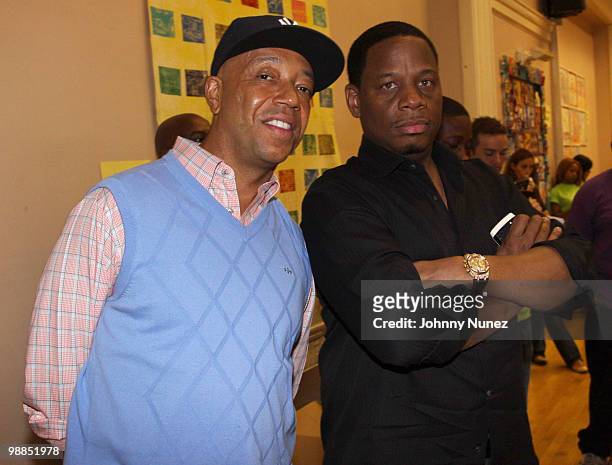 Russell Simmons and Kendu Isaacs visit P.S. 165 on May 4, 2010 in New York City.
