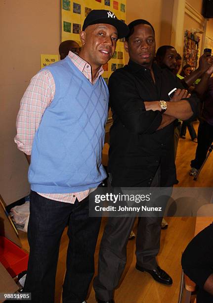 Russell Simmons and Kendu Isaacs visit P.S. 165 on May 4, 2010 in New York City.