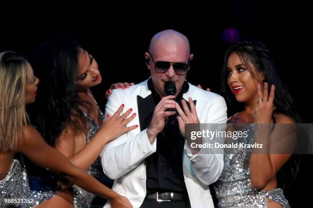 Pitbull performs with back up dancers in concert in the Etess Arena for the grand opening at Hard Rock Hotel & Casino Atlantic City on June 30, 2018...