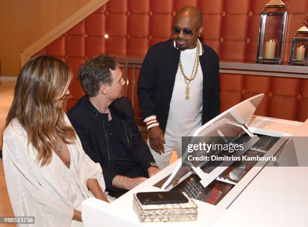 Model Heidi Klum, Niche Media and DuJour Media Jason Binn and composer, recording artist Jermaine Dupri attend a dinner at American Cut at Ocean...