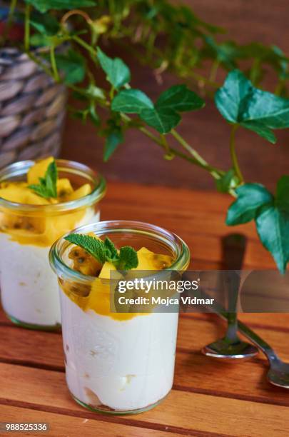 mango and passion fruit yoghurt dessert - mango leaf stock pictures, royalty-free photos & images