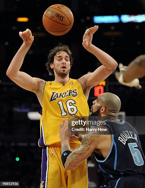 Pau Gasol of the Los Angeles Lakers passes the ball over Carlos Boozer of the Utah Jazz in the first half during Game Two of the Western Conference...