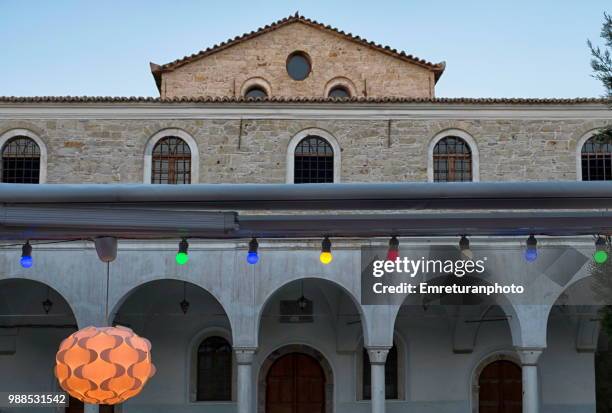 front facade of alacati mosque with colored lamps . - emreturanphoto stock pictures, royalty-free photos & images