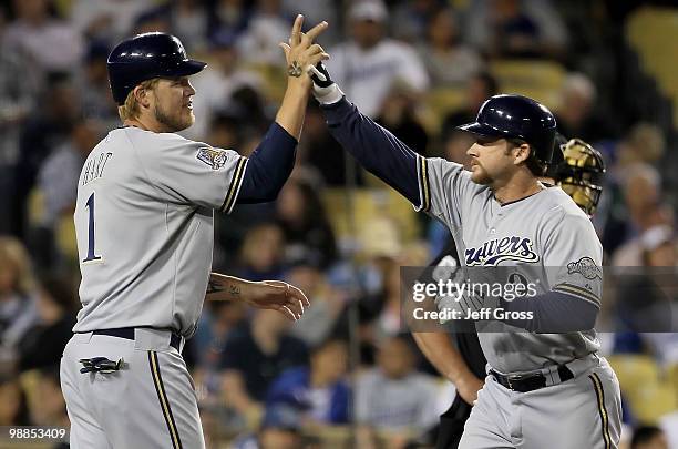 Corey Hart congratulates Gregg Zaun of the Milwaukee Brewers after Zaun hit a two-run homerun in the second inning against the Los Angeles Dodgers at...