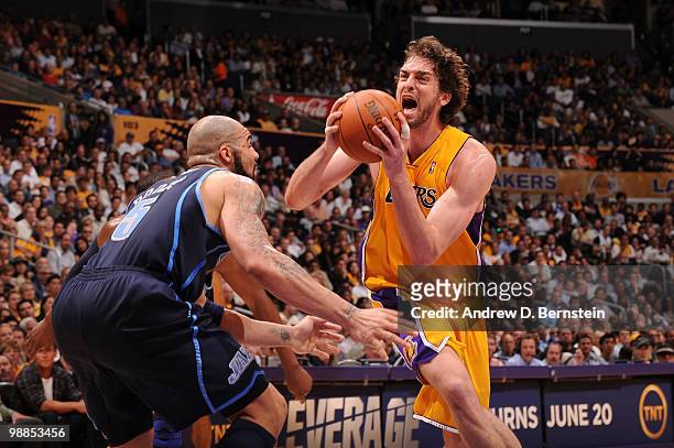 Pau Gasol of the Los Angeles Lakers goes to the hoop against Carlos Boozer of the Utah Jazz in Game Two of the Western Conference Semifinals during...
