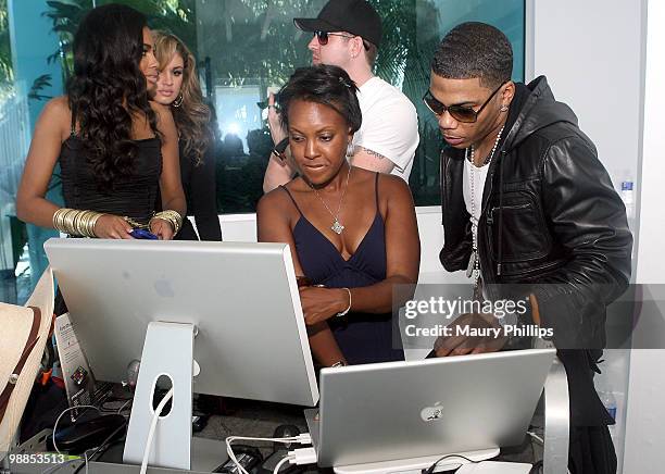 Nelly looks at the computer monitor during the Apple Bottoms Fall/Holiday Photo Shoot on May 4, 2010 in Malibu, California.