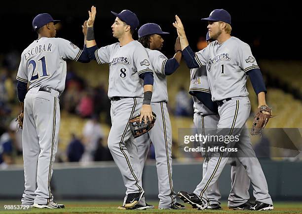 Alcides Escobar, Ryan Braun, Rickie Weeks and Corey Hart of the Milwaukee Brewers congratulate each other following their victory over the Los...