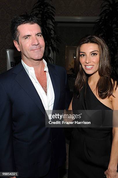 Television personality Simon Cowell and his fiancee Mezhgan Hussainy attend the BritWeek UKTI Business Innovation Awards where he received a special...