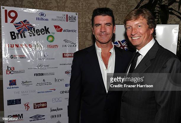 Television personality Simon Cowell and BritWeek President Nigel Lythgoe attend the BritWeek UKTI Business Innovation Awards at the Four Seasons...