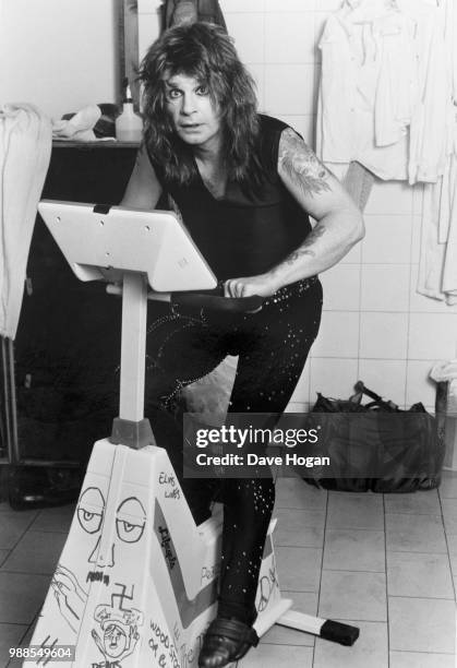 Singer Ozzy Osbourne poses for a portrait on an exercise bike, circa 1985.