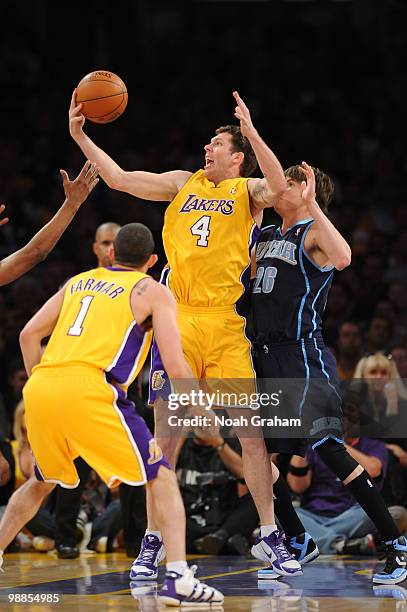 Luke Walton of the Los Angeles Lakers handles the ball against Kyle Korver of the Utah Jazz in Game Two of the Western Conference Semifinals during...